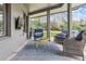 Covered outdoor patio with comfortable seating, a rug, and a mounted TV for entertainment at 5752 S Jasmine St, Greenwood Village, CO 80111