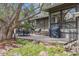 Spacious outdoor deck with seating, a grill, and steps leading down to a lush garden at 5752 S Jasmine St, Greenwood Village, CO 80111