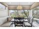 Bright dining area with bench seating and oversized windows that overlook the outdoor space at 5752 S Jasmine St, Greenwood Village, CO 80111
