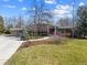 Beautiful home with mature landscaping and a circular driveway, offering ample space and curb appeal at 5752 S Jasmine St, Greenwood Village, CO 80111