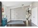 Bright foyer with modern wainscoting, dark hardwood floors, and a staircase leading to the upper level at 5752 S Jasmine St, Greenwood Village, CO 80111