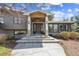 Inviting front entrance with stone accents, decorative wreath, and flagstone walkway create curb appeal at 5752 S Jasmine St, Greenwood Village, CO 80111