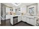 Modern kitchen with stainless steel appliances, undermount sink, and bright white cabinets at 5752 S Jasmine St, Greenwood Village, CO 80111
