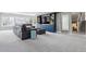 Open-concept living room with a stylish entertainment center and staircase at 5752 S Jasmine St, Greenwood Village, CO 80111