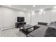 Cozy living room with a sectional sofa, dark coffee table, and built-in closet at 5752 S Jasmine St, Greenwood Village, CO 80111