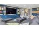 Spacious living room with a large sectional, built-in entertainment center, and open layout at 5752 S Jasmine St, Greenwood Village, CO 80111