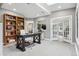 Bright office space with a large desk, bookcase, and french doors leading to the outside at 5752 S Jasmine St, Greenwood Village, CO 80111