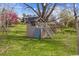 Backyard featuring a charming two-story playhouse with a climbing wall and stairs at 5752 S Jasmine St, Greenwood Village, CO 80111