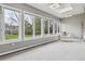 Bright sunroom featuring a row of large windows, a skylight, and cozy seating at 5752 S Jasmine St, Greenwood Village, CO 80111