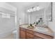 Bathroom with double sinks, a soaking tub, and a separate shower at 2274 Valentia St, Denver, CO 80238