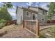 Exterior view of backyard with grassy space, patio, and partial fence providing outdoor enjoyment at 19688 E Lasalle Dr, Aurora, CO 80013
