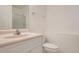 Clean bathroom with a single sink vanity, white toilet, and a glass-enclosed shower for a functional space at 19688 E Lasalle Dr, Aurora, CO 80013