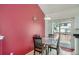Cozy dining area with a red accent wall, perfect for intimate meals and gatherings at 19688 E Lasalle Dr, Aurora, CO 80013