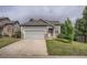 Charming single-Gathering home featuring a two-car garage and well-maintained front yard with mature trees at 19688 E Lasalle Dr, Aurora, CO 80013