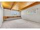 Bright bedroom with wood beam ceilings and large windows at 1 Lindenwood Dr, Littleton, CO 80120