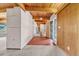 Bright entryway showcasing wood beam ceilings and a ceramic tile floor at 1 Lindenwood Dr, Littleton, CO 80120