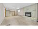 Living room with fireplace and bookshelves at 1 Lindenwood Dr, Littleton, CO 80120