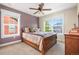 Inviting bedroom featuring a plush bed, natural light, and stylish furnishings for a relaxing retreat at 8029 E 23Rd Ave, Denver, CO 80238