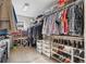 Spacious walk-in closet with ample shelving, hanging racks, and storage solutions for an organized wardrobe at 8029 E 23Rd Ave, Denver, CO 80238
