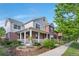 Charming two-story home with a welcoming front porch, landscaped garden, and beautiful curb appeal at 8029 E 23Rd Ave, Denver, CO 80238
