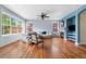 Sun-filled living room with hardwood floors, fireplace, and stylish furnishings at 8029 E 23Rd Ave, Denver, CO 80238