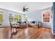 Living room with lots of natural light, hardwood floors, and a cozy atmosphere at 8029 E 23Rd Ave, Denver, CO 80238