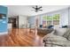 Bright open floor plan with hardwood floors, a dining area, and comfortable living space at 8029 E 23Rd Ave, Denver, CO 80238