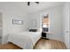 Bedroom featuring hardwood floors and a large window that provides natural light at 2919 N York St, Denver, CO 80205