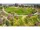 Expansive green park with walking paths, mature trees and a beautiful city skyline in the background at 1930 E 8Th Ave, Denver, CO 80206