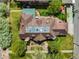 Aerial view of a charming home featuring a well-manicured lawn and mature trees at 1930 E 8Th Ave, Denver, CO 80206