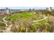 Overhead view of green open space with winding paths and distant city skyline at 1930 E 8Th Ave, Denver, CO 80206