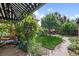 Lovely backyard space with lush green lawn, a patio, and a charming brick path at 1930 E 8Th Ave, Denver, CO 80206
