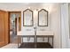 Bright bathroom featuring double sinks with framed mirrors and stylish fixtures at 1930 E 8Th Ave, Denver, CO 80206
