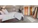 Cozy bedroom with neutral tones, plush carpet, and a comfortable queen size bed at 1930 E 8Th Ave, Denver, CO 80206