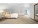 Bright bedroom featuring plush carpet, neutral colors, and a large window at 1930 E 8Th Ave, Denver, CO 80206