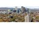 Stunning Denver skyline featuring modern buildings and a backdrop of the Rocky Mountains at 1930 E 8Th Ave, Denver, CO 80206
