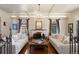 Bright living room featuring hardwood floors, a fireplace, and large windows for ample natural light at 1930 E 8Th Ave, Denver, CO 80206