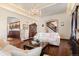 Cozy living room with hardwood floors, white sofas, and a view into the kitchen and dining area at 1930 E 8Th Ave, Denver, CO 80206