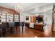 Elegant living room with grand piano, built-in bookcase and cozy leather sofa at 1930 E 8Th Ave, Denver, CO 80206
