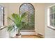 Beautiful arched window adorned with decorative glass panes, providing serene views of the outdoors at 1930 E 8Th Ave, Denver, CO 80206