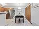 Bright dining room with modern light fixture and seating for four at 203 Wright St # 102, Lakewood, CO 80228