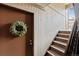 Warm entryway with wood paneling and stairway at 203 Wright St # 102, Lakewood, CO 80228