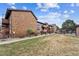 View of the condo community showcasing manicured lawns and landscaping at 203 Wright St # 102, Lakewood, CO 80228
