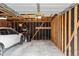 Spacious garage interior featuring ample storage and parking for vehicles and equipment at 203 Wright St # 102, Lakewood, CO 80228