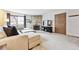 Cozy living room boasts a stone fireplace, TV, and comfortable seating at 203 Wright St # 102, Lakewood, CO 80228