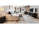 Stylish living room with stone fireplace, entertainment center, and comfortable seating at 203 Wright St # 102, Lakewood, CO 80228