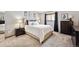 Serene bedroom with plush carpeting, a large window with dark curtains, and stylish black and white decor at 203 Wright St # 102, Lakewood, CO 80228