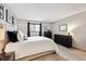 Inviting bedroom with soft carpeting, a bright window, and elegant decor, creating a calming retreat at 203 Wright St # 102, Lakewood, CO 80228