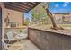 Private patio with seating area and decorative landscaping offering a relaxing outdoor space at 203 Wright St # 102, Lakewood, CO 80228