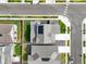 An aerial view of a home featuring solar panels, a backyard patio and a lush green lawn at 17765 Faraday St, Broomfield, CO 80023